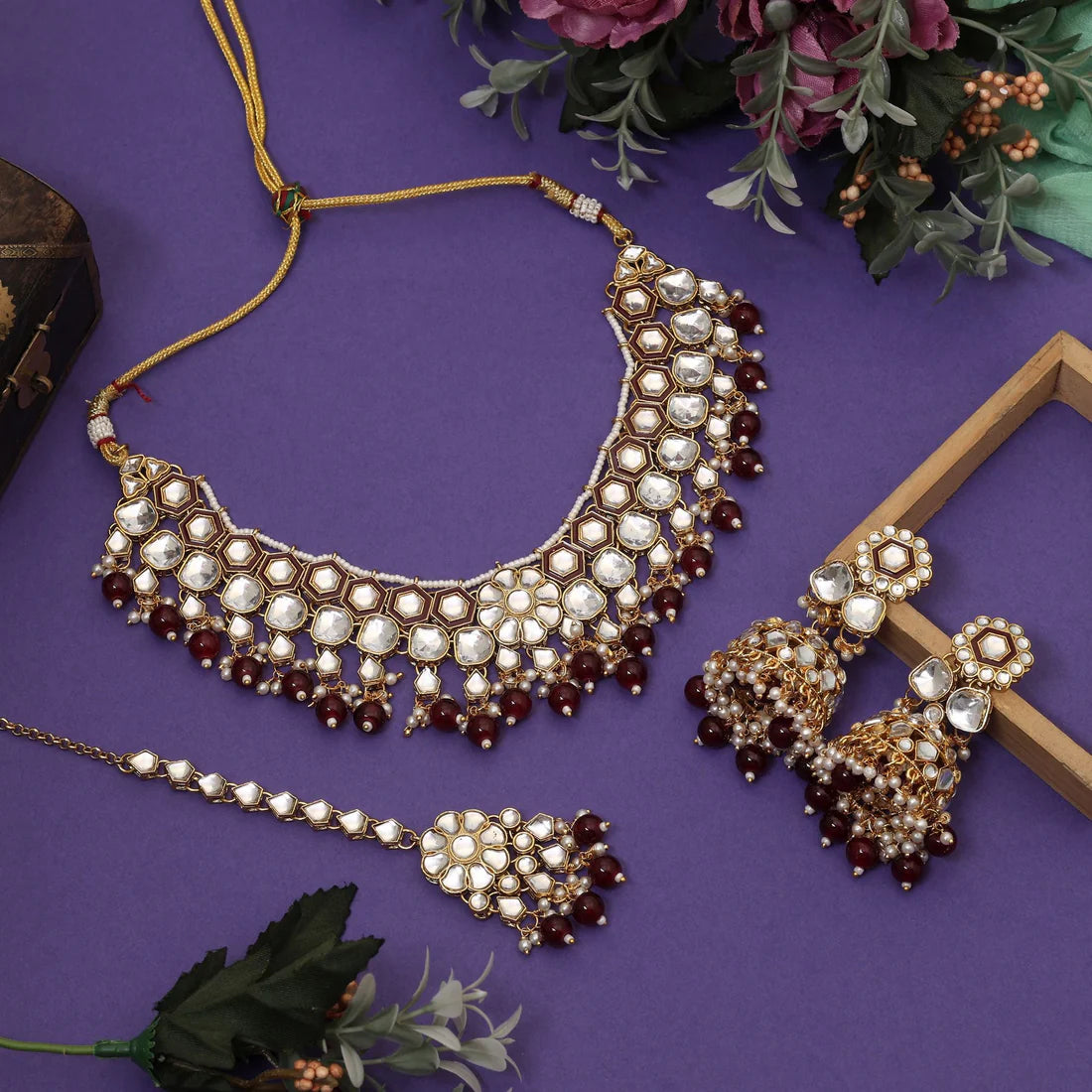 Elegant Maroon Color Meena Work Kundan Necklace Set Designed For Weddings And Traditional Celebrations