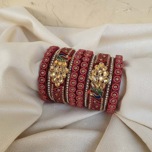 https://femnari.com/products/maroon-color-peacock-inspired-1-set-of-thread-bangle-size-2-6-trb102mrn-2-6#:~:text=Maroon%20Color%20Peacock%20Inspired%201%20Set%20Of%20Thread%20Bangle%20With%20Traditional%20Handcrafted%20Appeal